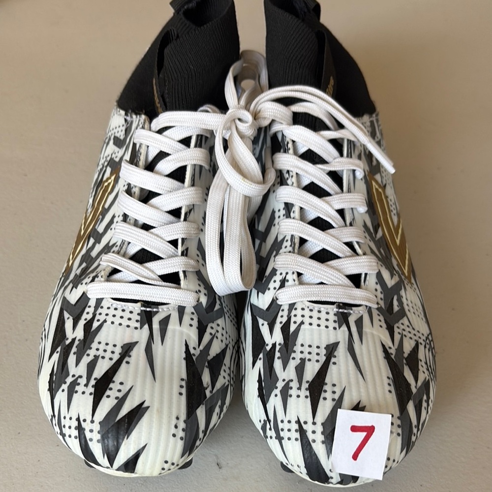 Dynamic Black and White Athletic Shoes with Gold Accents